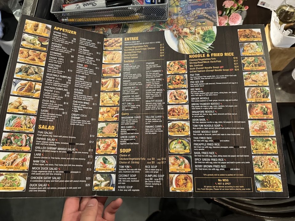 Thai menu with bold category headings.
